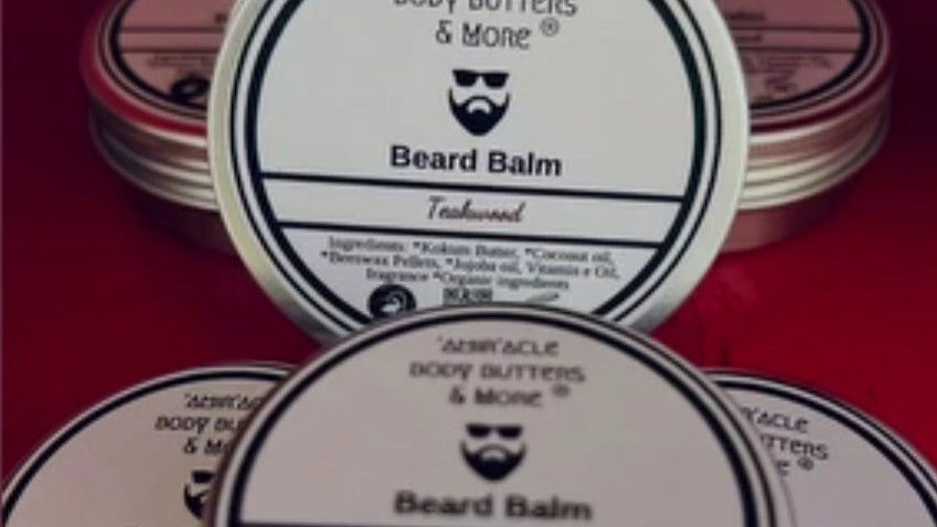 Tin of shea butter beard balm for taming flyaways and locking in moisture by Amir'acle Body Butters